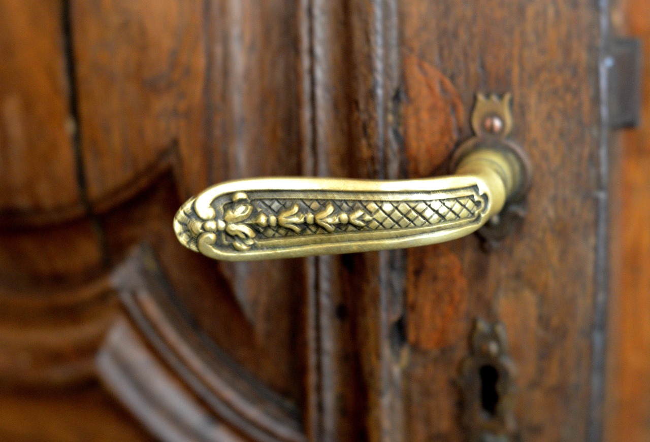The ornate brass handle on the chambers' front door